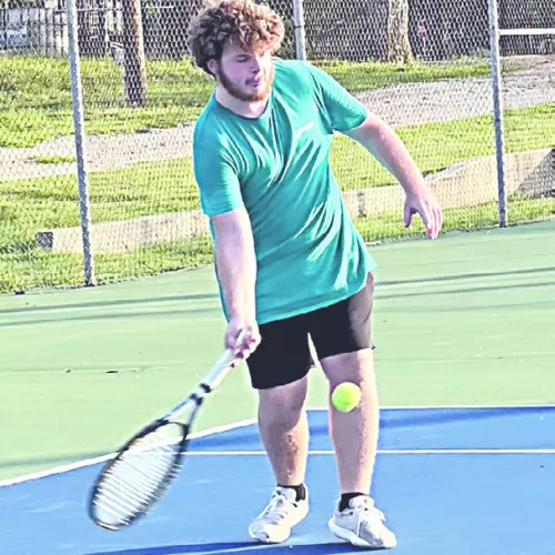 Tiger varsity tennis player Tyler Roberts hit the court last week in the heat for some summer fun and practice. Reporter/Ken Ansell