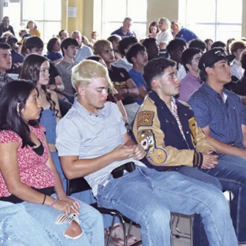 Above, Rockdale student athletes wait to hear their name called during last week’s athletic banquet. At right, Rockdale Athletic Director/Head Football Coach Hunter Hamrick speaking at the banquet. A full list of award winners will be available in next week’s Reporter. Rockdale Tigers Athletics photos