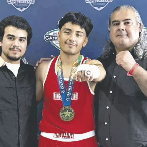 WINNER— Incoming Rockdale High School junior Jeremiah Fernandez won his Texas Amateur Athletic Federation boxing tournament and placed first in his division at the 2025 Games of Texas in College Station. Fernandez won a first-place medal and a 2025 Texas Amateur Federation Ring. He is now 2-0 representing Rockdale. Fernandez (center) is shown here with his coach Armando Rodgituez (R) and Rodriguez’s son Carlos Rodriguez.