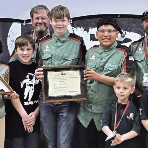 PRESENTATION—Texas House Rep. Stan Gerdes gave Trail Life Troop TX-1516 a Texas flag that was flown over the Texas Capital in honor of the troop. Included was a certificate that read in part, this flag “was flown at the Capital of the Sovereign State of Texas in recognition of your organization providing youth mentorship and character development.” Our local Rockdale Trail Life Troop is proud to have received this flag. We are very thankful to Rep. Gerdes for honoring us in this way,” said Pastor Steve Ammo