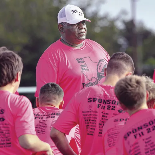 Coach Deron Clay addresses campers before drills begin during Saturday’s annual Fit 22 Football Camp at Tiger Stadium in Rockdale. Participants spent the day working through drills and receiving instruction designed to prepare them for the upcoming football season. Coaches from across Texas provided instruction throughout the day, and the camp concluded with awards recognizing outstanding campers. Photo by Kells Image