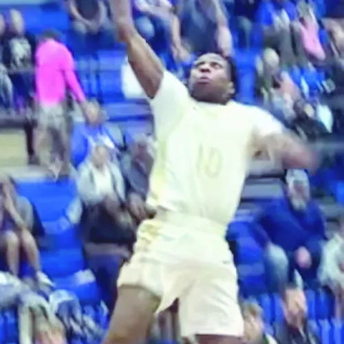 At right, Tiger De’Andre Stephens goes up for a dunk against Franklin Friday night in Tiger Gym. Stephens ended the night with 9 points for the Tigers in their 75-45 victory. Photo extracted from a video by Destin Richardson