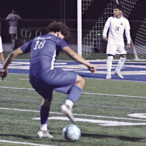 Tiger Wilmer Sorto (18) gets through defenders on Friday night at Tiger Stadium. Sorto scored three of the Tigers four goals in their 4-2 victory of the Yoemen. Reporter/Nathan Flores