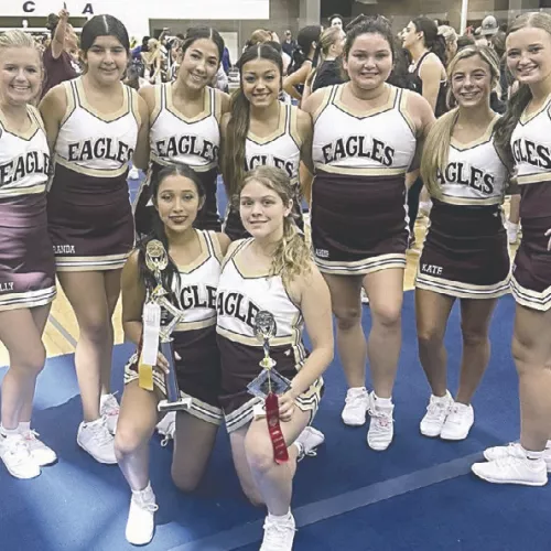 Milano varsity cheerleaders receive hardware at camp