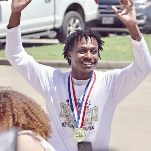 Tiger senior De’Andre Stephens is welcomed home after being crowned state champ in the high jump. Rockdale Tigers Athletics photo