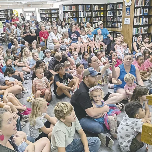 STANDING ROOM ONLY— Wild Things Zoofari was a huge success on Friday at the Lucy Hill Patterson Memorial Library as over 260 people packed the house to see lots of animals. Dylan McDaniel, who owns the animals, brought a red ruffed lemur, a chocolate skunk, a soft chinchilla, a tenrec from Madagascar, a Fennec fox and a 9-month-old kangaroo. All the kids got to pet the chinchilla and the kangaroo. See more photos on page 10A.