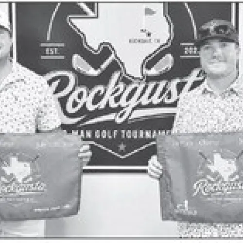 Champ Flight winners Tucker Tovar (left) and Jakob Mikel display their championship flags after winning the top flight at the fourth annual Rockgusta Two-Man Scramble, held July 11-12 at the Rockdale Country Club. The tournament attracted 55 teams competing across five flights. Rockdale Country Club photos