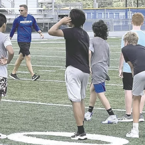 Student-athletes receive instructions from Rockdale High School head football coach Hunter Hamrick in last week’s final summer strength and conditioning program. Reporter/Ken Ansell