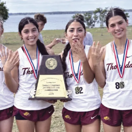 Thorndale swept the District 27-2A varsity cross country titles Oct. 12 in Granger, sending both teams to regionals. The Lady Dogs (above) earned their fourth straight championship with 23 points, led by Raven Sandoval, Skielee Bear and Nadia Gonzalez’s sweep of the top three places. The Bulldogs (below) claimed their third consecutive title with 18 points as individual champion Jamie Llanas led five Thorndale runners into the top six. Thorndale ISD Athletics photos