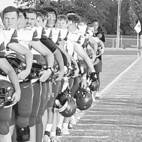 The Milano Eagles line up for the national anthem before Friday night’s game in Axtell. Milano High School photo