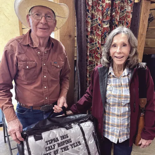 SENIOR PRO RODEO— Jerry Cass, 83, won several awards at the Texas Senior Pro Rodeo Association held in Hamilton. Cass won the saddle in both the age 75-plus tiedown and the age 80-plus breakaway. His horse, Waylon, won the calf roping horse of the year which is voted on by other ropers in the association. He is shown here with his wife, Kyle.