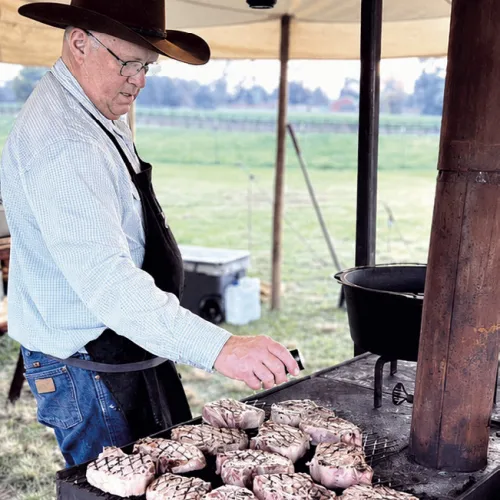Jeffrey Mueller cooking in his chuckwagon.