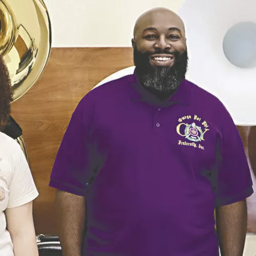 MEET THE BAND DIRECTOR— About 60 people welcomed new band director Samuel W. Long, Jr. on Monday night at RHS. Long is shown here with students Destinee Bluford (left) and Annabelle Henderson.