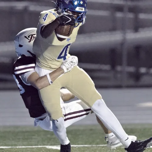 Rockdale receiver Kendrick Henderson hauls in the only touchdown for the Tigers on Friday night. Photo by Steve Young
