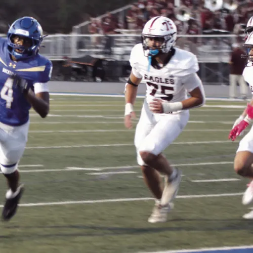 Rockdale receiver Kendrick Henderson (4) evades the Eagle defense on his way to a touchdown. Henderson led the Tigers Friday with three touchdowns on the night. Reporter/Nathan Flores