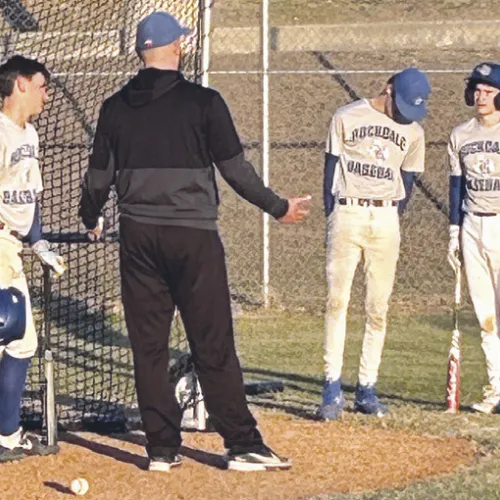 Rockdale Coach Pearce Loth gives words of wisdom to the Tiger baseball team. Reporter photo/Nathan Flores