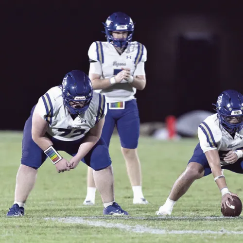 Photo by Steve Young The Tiger offense, led by quarterback Greyson Williams (7), lines up for a play Friday night against the Rogers Eagles at Merk Field. The Eagles claimed their first victory over Rockdale since 1944’s 6-0 win.
