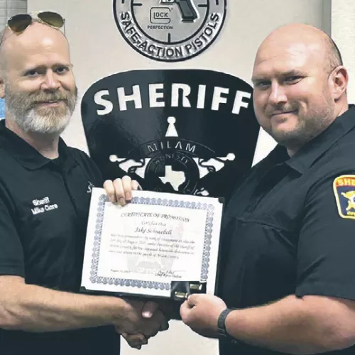 PROMOTION— Milam County Sheriff Mike Clore presents newly minted Lieutenant Jake Schneebeli with his promotion certificate. “Lt. Schneebeli started with the sheriff’s office in 2022 and has proven to be a good leader and hard worker,” Clore said. “Schneebeli graduated from the Police Academy this past December and now he’s earned this deserved promotion.