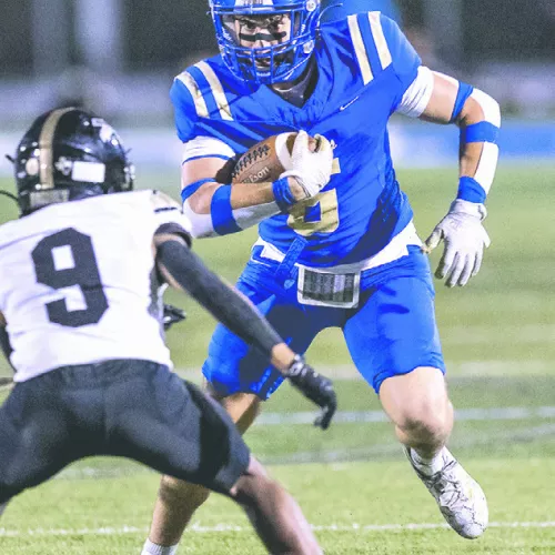 Above, Tiger Brody Willard (6) looks for yardage after a catch from Rockdale QB Greyson Williams Friday night. Top right, Tiger receiver De’Andre Stephens (10) cuts