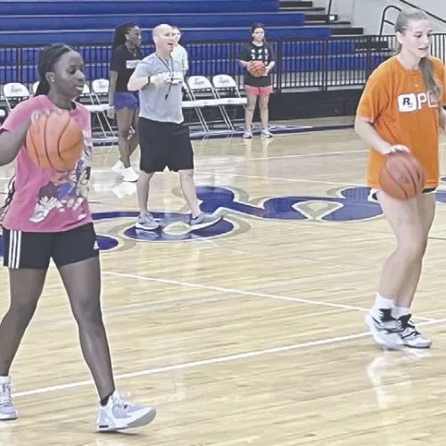 New girls basketball Coach Young has girls working on skills at summer strength and conditioning sessions. Reporter/Ken Ansell
