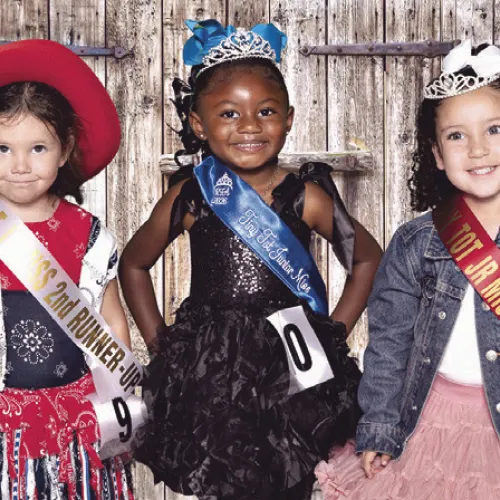 Tiny Tot Junior Miss (L-R) second runner-up Luna Kidd, 2026 Rockdale Fair Tiny Tot Junior Miss Stormi Martin, first runner-up Hadlee Earl.