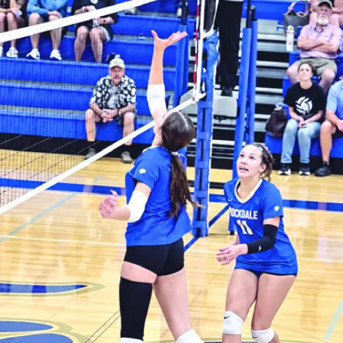 Lady Tiger Paisly Fisher (8) goes up for an attack against Caldwell as teammate MaKenzi Valdivia (11) moves into position. Photo by Brooksy Fisher