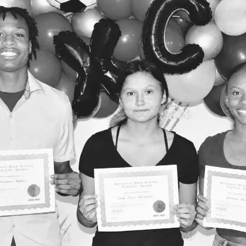 The Rockdale High School Outstanding Male Athlete of the Year was De’Andre Stephens (L), while Hannah Mckie (center) and Trinity Hurd shared the Outstanding Female Athlete of the Year award at the recent RHS Athletic Banquet. Photo by Morgan Hamrick