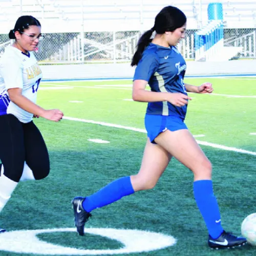 Rockdale Lady Tiger Lilly Matula is pursued downfield last week in the soccer match against La Grange at Tiger Stadium. Rockdale lost the game, 2-0. Reporter/Nathan Flores
