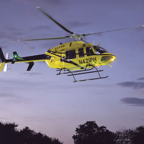 SALUTING FIRST RESPONDERS— PHI Air Ambulance Network delivered the game ball Friday night at the Tigers vs. Rogers Eagles’ game at Merk Field in tribute to the 9/11 first responders. See more in Sports starting on page 1B. Photo by Steve Young