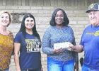 The 22nd annual Community Outreach Thanksgiving Dinner, which will be held Saturday at the First Baptist Church from 11 a.m. to 2 p.m., got a $200 boost from the Rockdale Rotary Club. Shown here (L-R) are Rotary members Gaye Bland, Melissa Barcuch, dinner organizer Pam King and Rotary member Homer Mowdy.